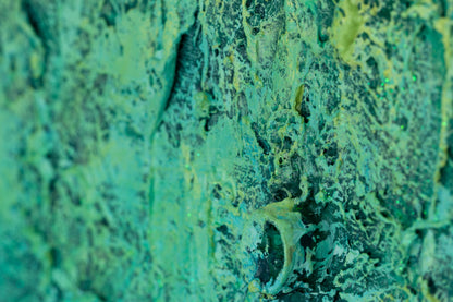 Close-up of the green area in ‘The Grounding,’ abstract art by Pamela Rys, illustrating the dynamic energy flow and grounding effect of pranic healing.