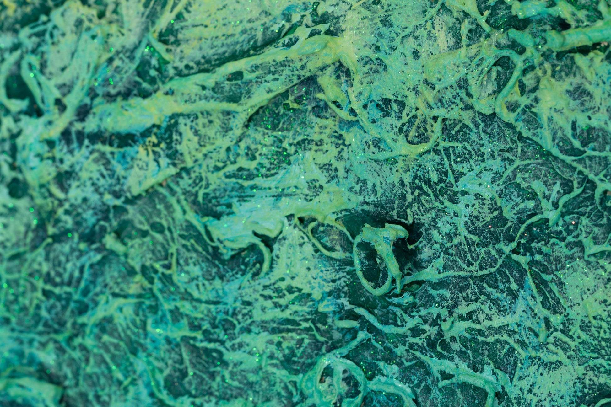 Close-up of vibrant green color areas in ‘The Grounding’ by Pamela Rys, showcasing the abstract art's energy and grounding, pranic healing influence.